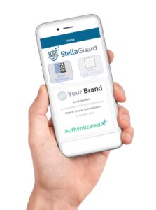 Hand holding a smartphone with StellaGuard shown on the screen